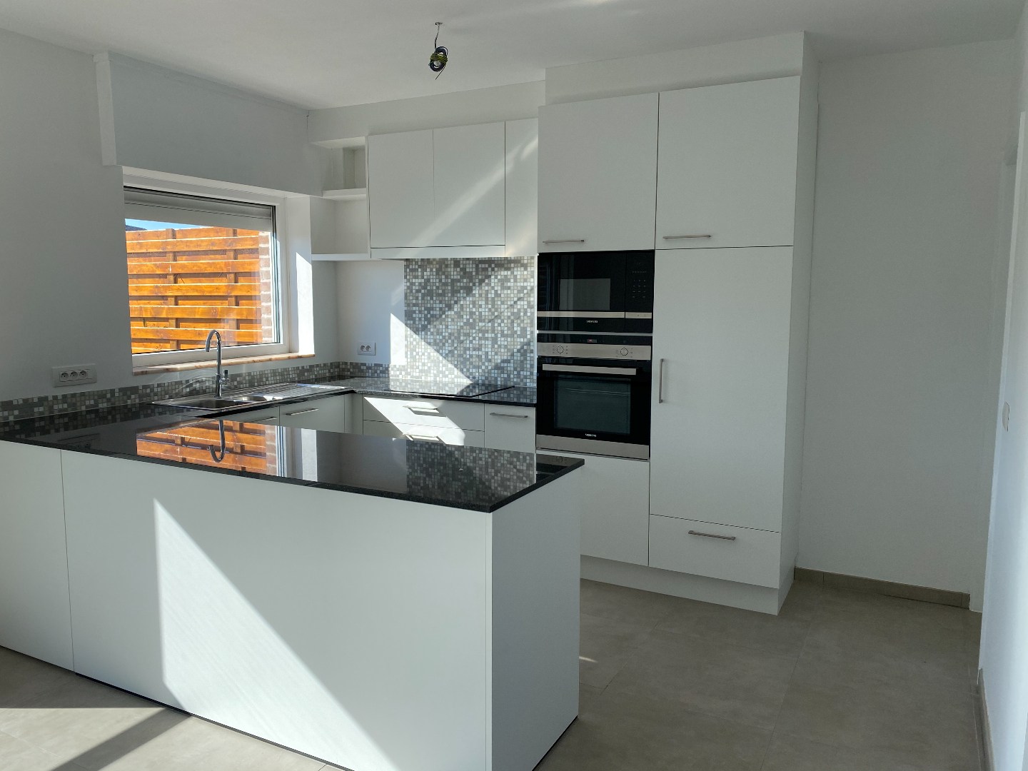 Energiezuinige halfopen woning met tuin en carport te Zulte 