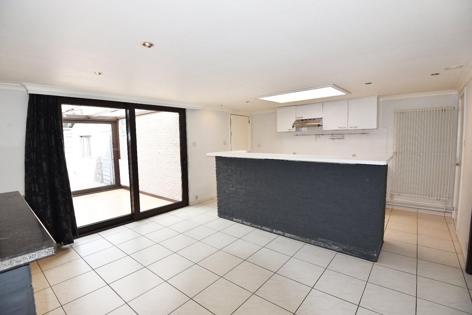 Op te frissen woning met 2 slpks, garage (55m²) en tuin te Balgerhoeke 