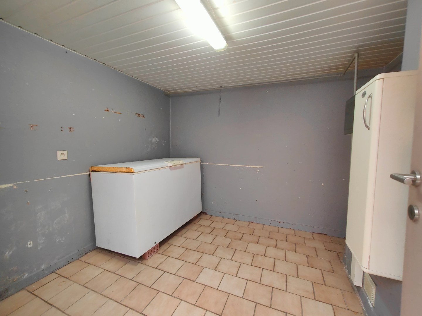 Op te frissen woning met tuin en berging op centrale ligging 