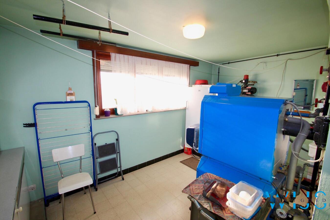 Zeer degelijk woonhuis op een ruim rustig perceel te Bassevelde ! 