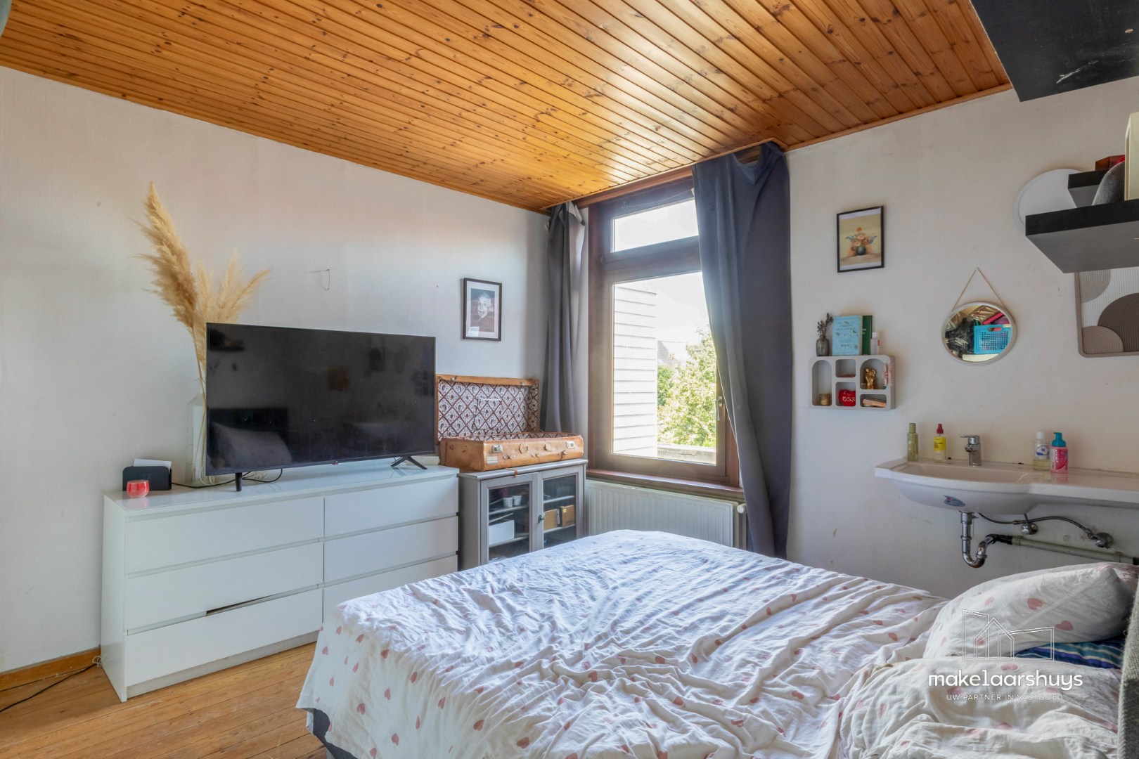 Ruime woning met 4 slpk en aangename tuin te Sint-Amandsberg 