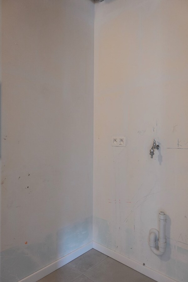 Nieuwbouwappartement met terras en tuin 