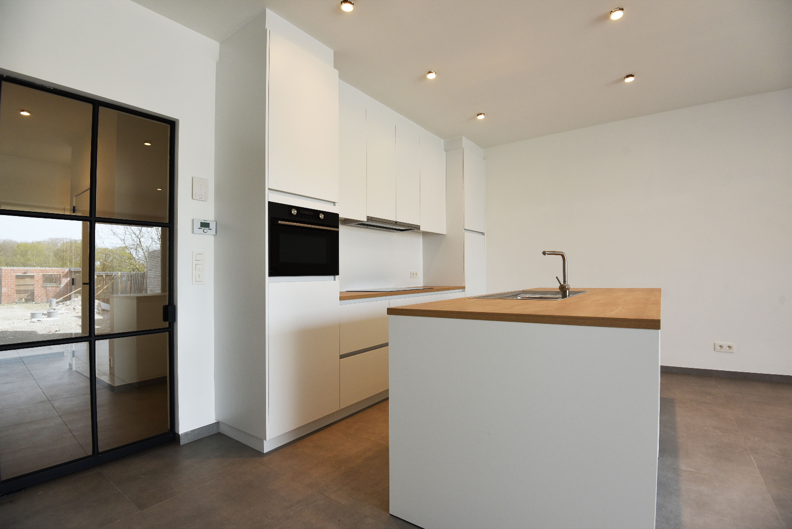 Nieuwbouw appartement met 1 slaapkamer, terras en tuin te Lembeke-Dorp 