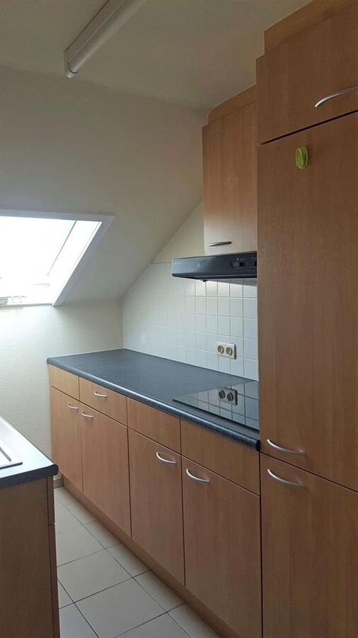 Instapklaar dakappartement met garagebox in Kuringen 