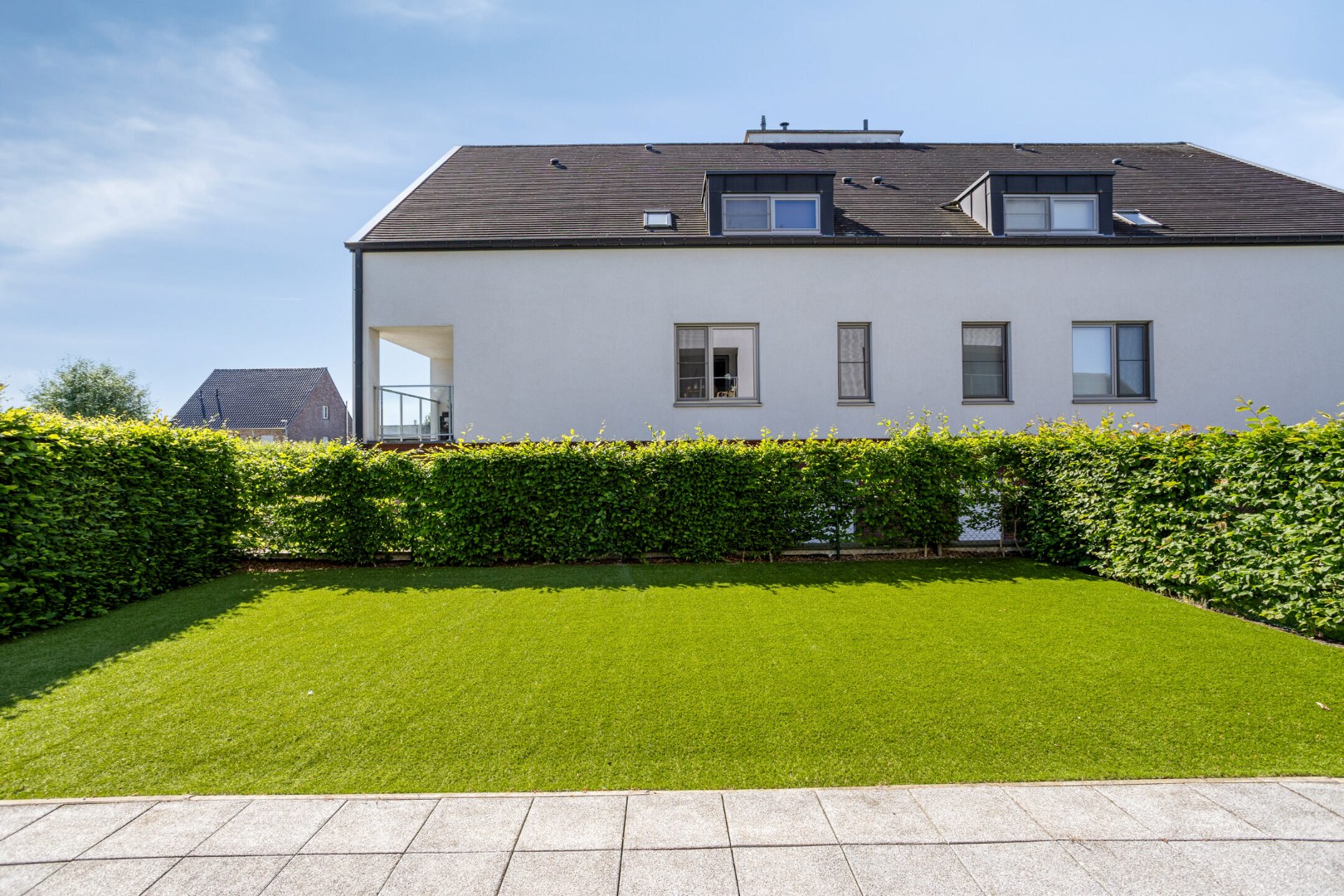 Instapklaar gelijkvloers appartement met groot terras, tuin en garagebox in Kumtich - EPC 104 KWH/m² 