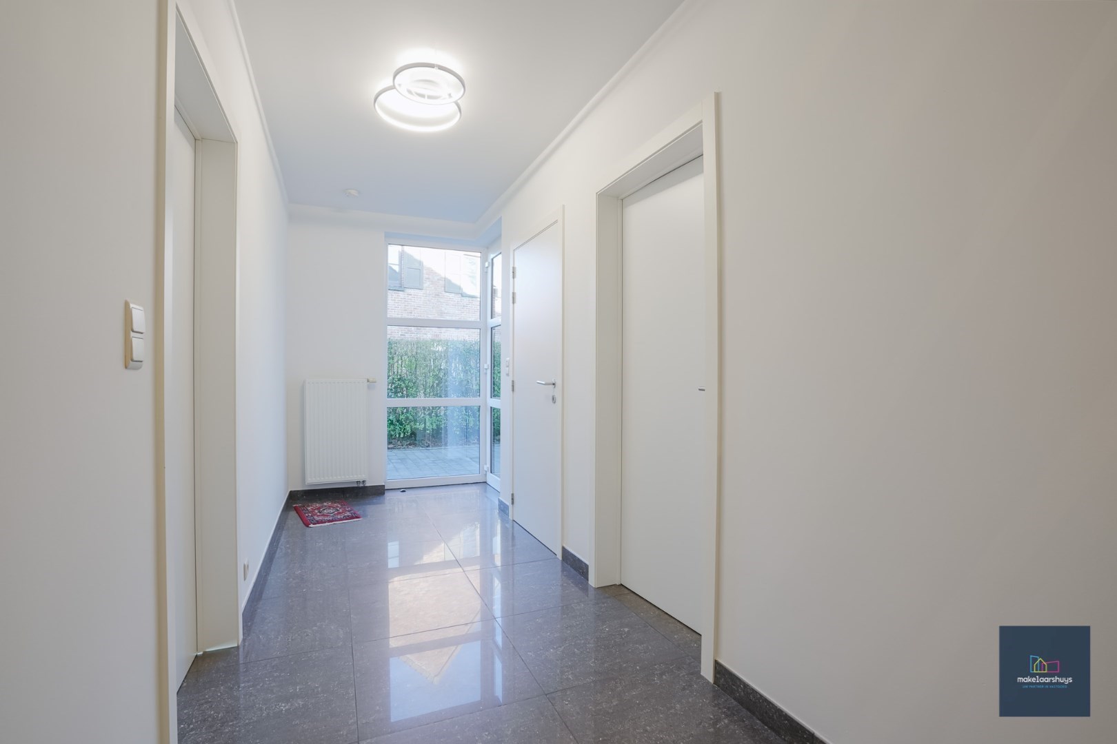 Ruime half-open bebouwing te Heusden met garage en tuin 