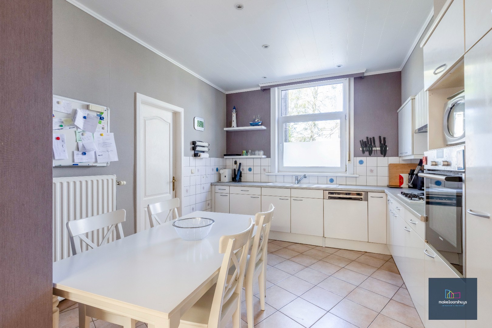 Goed onderhouden en ruime woning in rij met tuin/terras te Wondelgem 