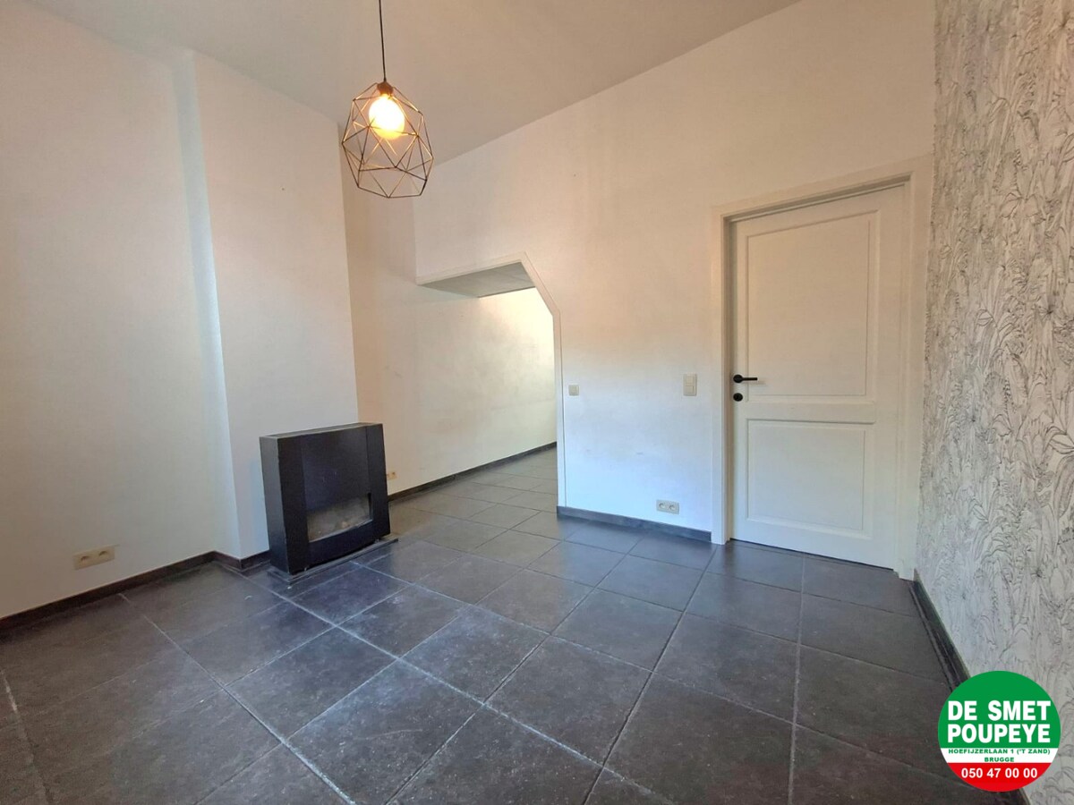 Rijwoning met tuin met uitweg 