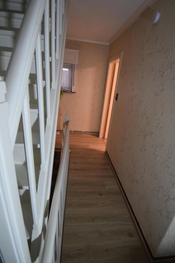 Ruime halfopen 3-slaapkamer-woning met garage en tuin 