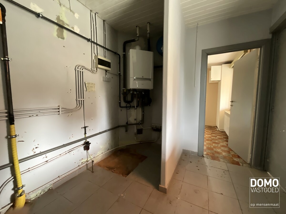 WONING MET TUIN, GARAGE EN 3 SLAAPKAMERS IN HET CENTRUM VAN KERMT 