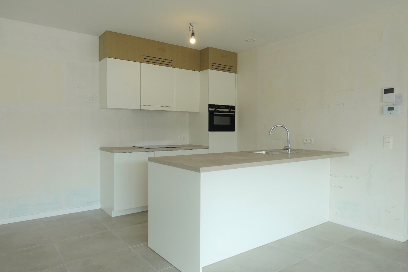 Nieuwbouwappartement met terras en tuin 