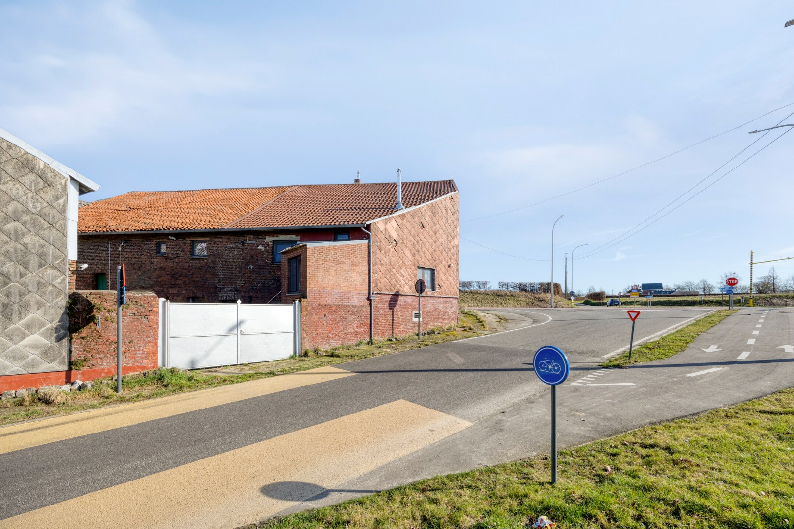 zijgevel met toegangspoort aan de Bosstraat