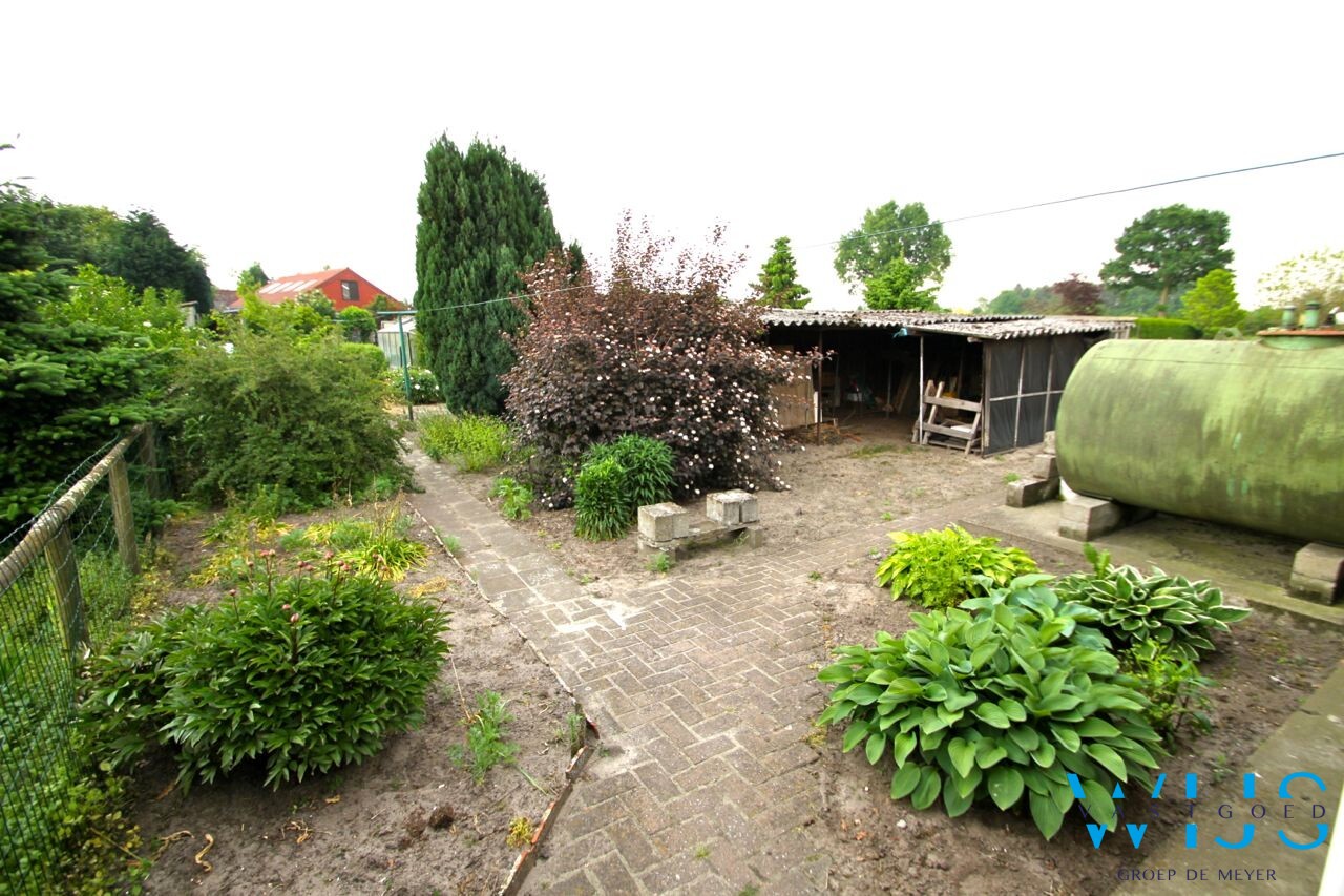 Centraal gelegen woning met mooie grond te Ertvelde! 