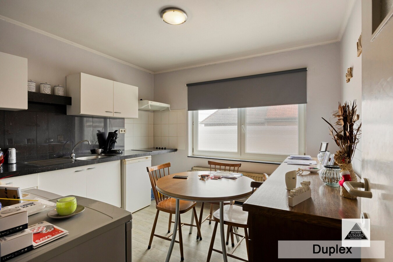 Dilsen-centrum - opbrengstpand: winkel + 2 appartementen 