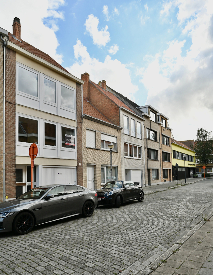 KNAPPE BEL-ETAGE WONING MET GARAGE EN ZUID-GERICHTE TUIN 
