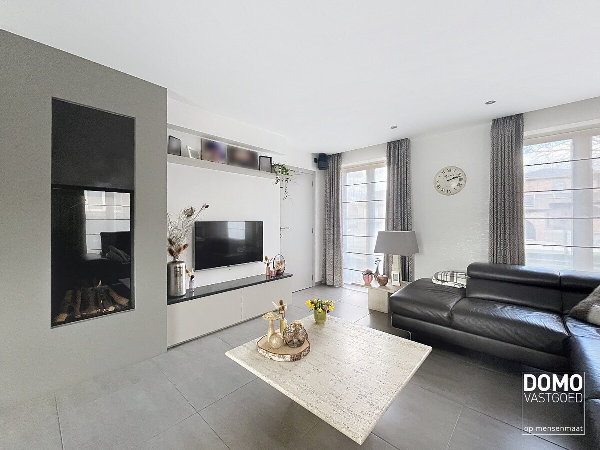 Ruime woning met 4 slaapkamers, groene tuin, terras en inpandige garage 