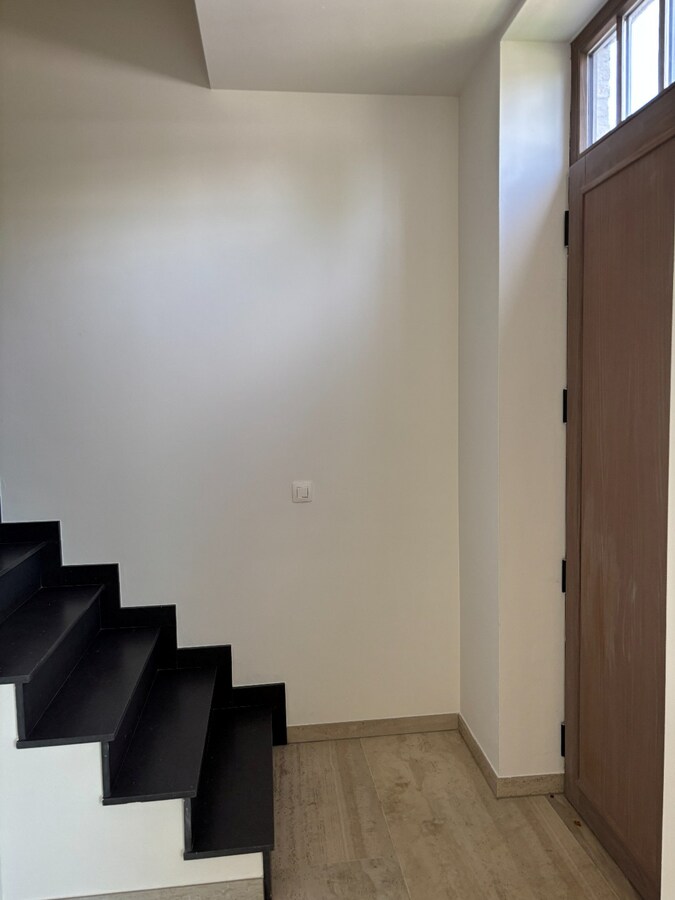 Nieuwbouwwoning met West-tuin in het centrum van Schilde 
