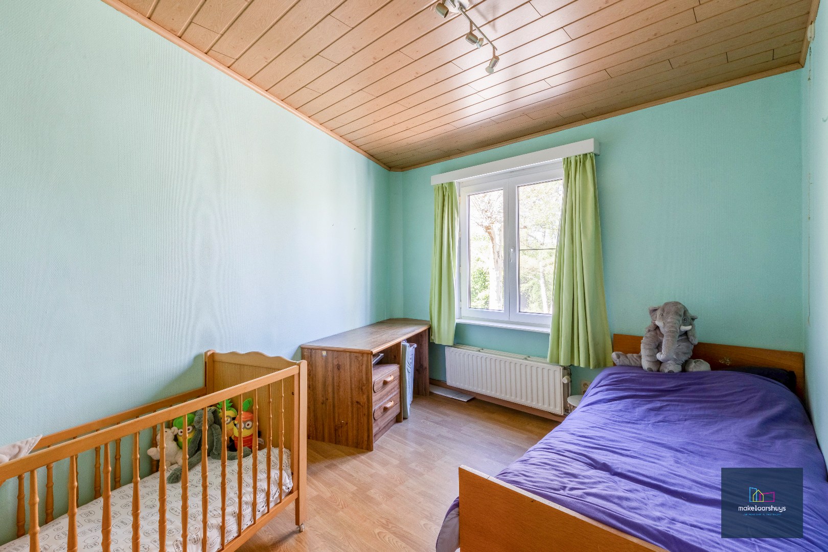 Goed onderhouden en ruime woning in rij met tuin/terras te Wondelgem 