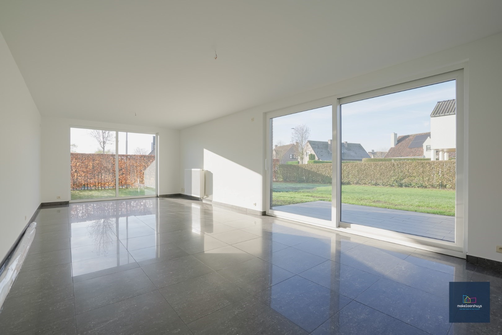 Ruime half-open bebouwing te Heusden met garage en tuin 