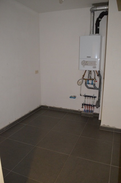 Gelijkvloers appartement met 2 slpks, terras, tuin en garage te Maldegem 