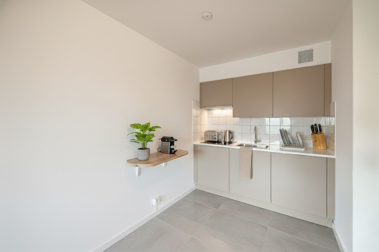 Eénslaapkamerappartement met optie voor één of twee afgesloten garageboxen op TOPLOCATIE aan Gent-Sint-Pieters 