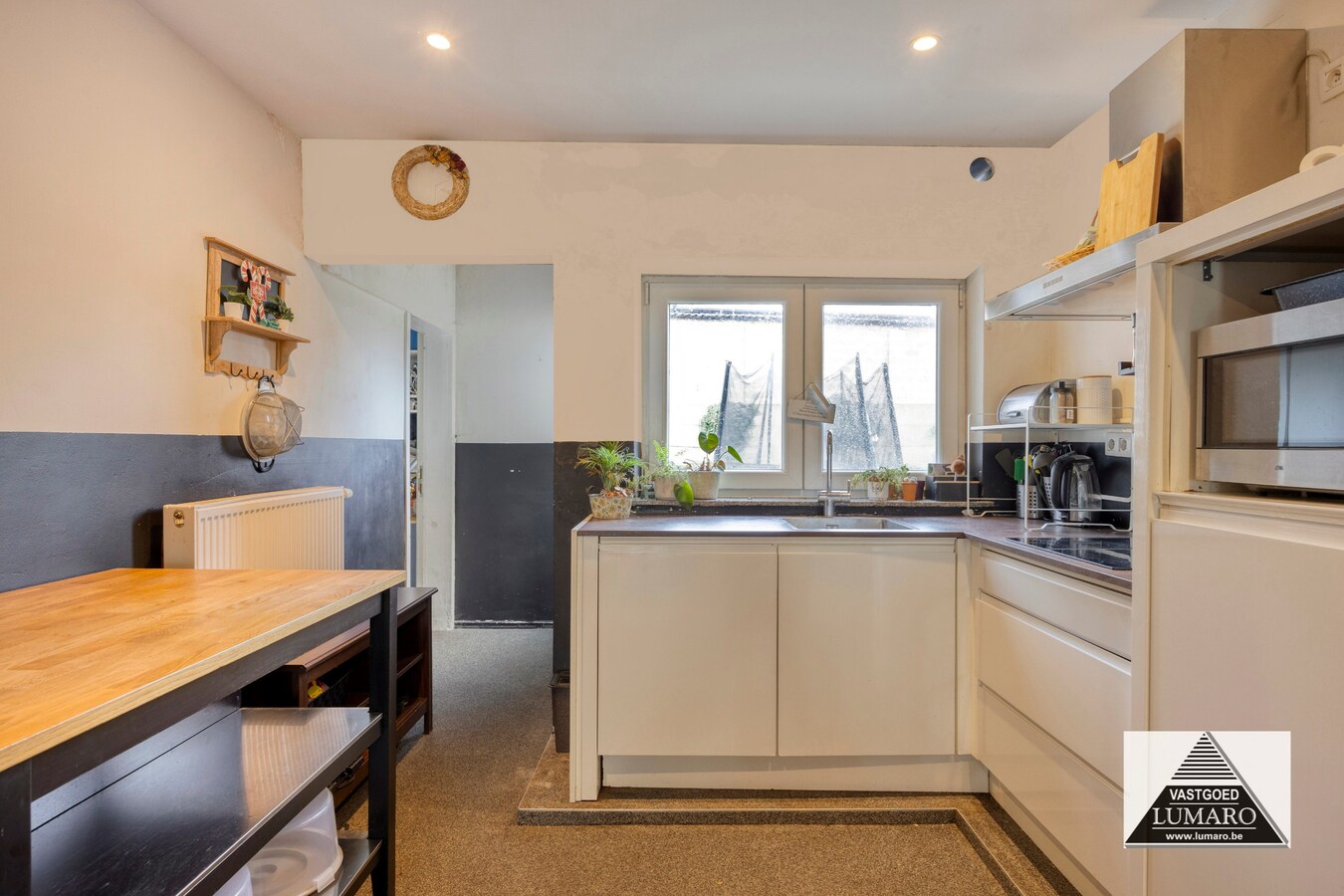 Ideale praktijk- of kangoeroewoning met tuintje en parking 