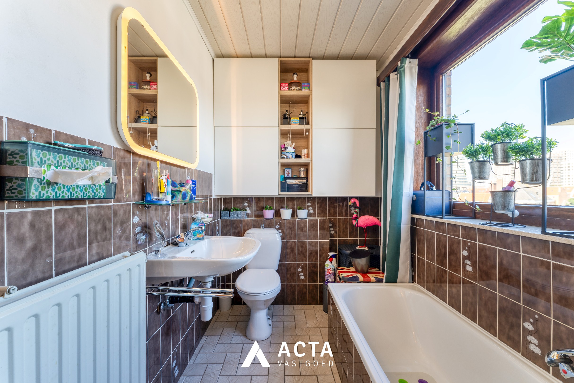 Dakappartement met zonnige terrassen in Mariakerke 