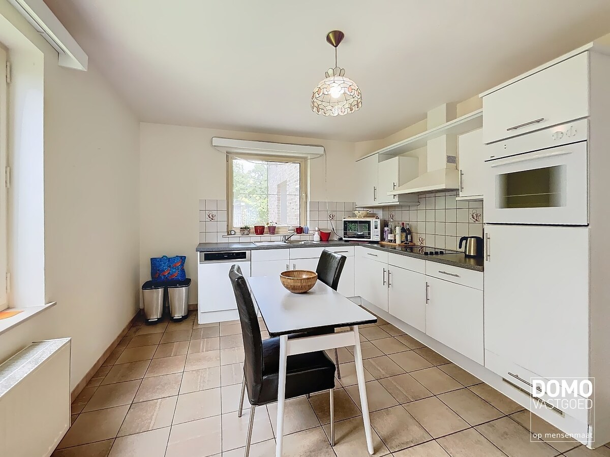 GELIJKVLOERS APPARTEMENT MET TUIN EN GARAGEBOX GELEGEN TE TUILT  (KURINGEN) 