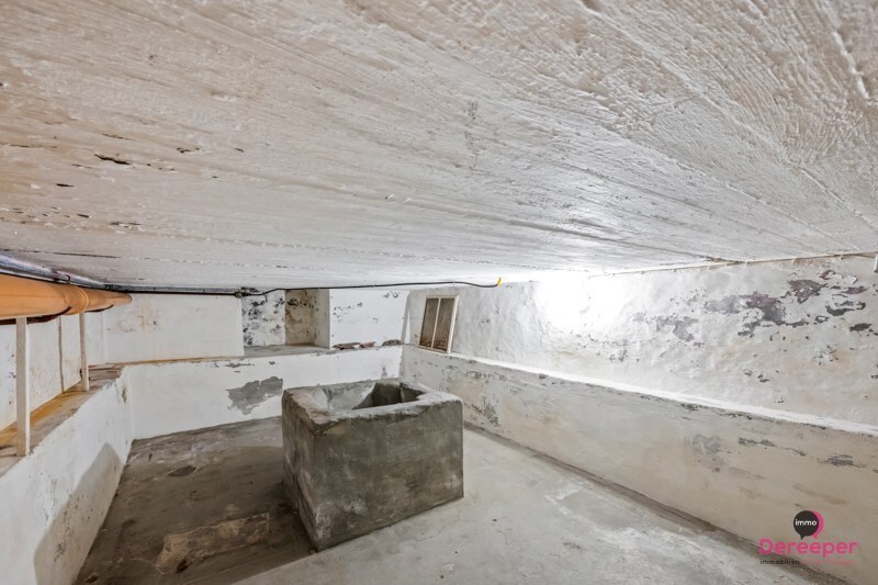 Te renoveren rijwoning op centrale ligging met leuke zuidgerichte tuin 