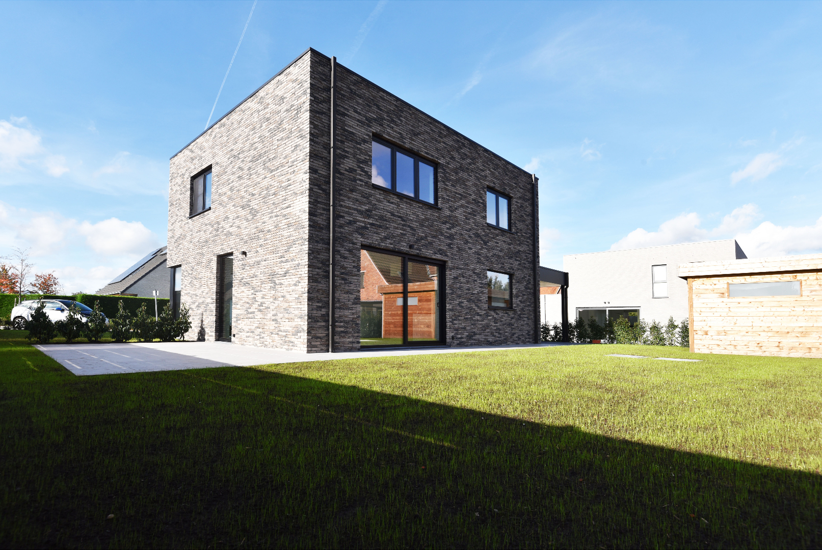 NIEUWBOUW open bebouwing (BEN-woning) met 3 slpks, carport, tuinhuis en tuin te Adegem 