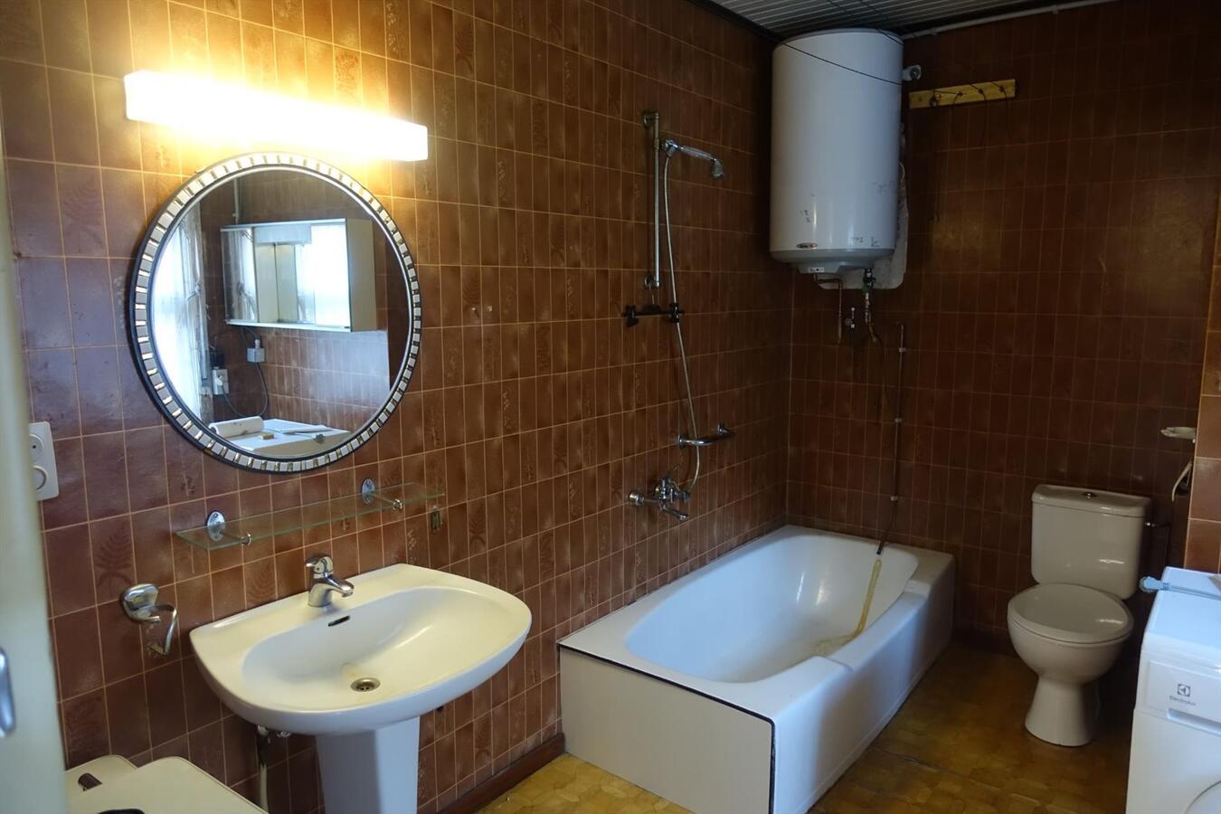 Degelijke halfopen woning met garage 