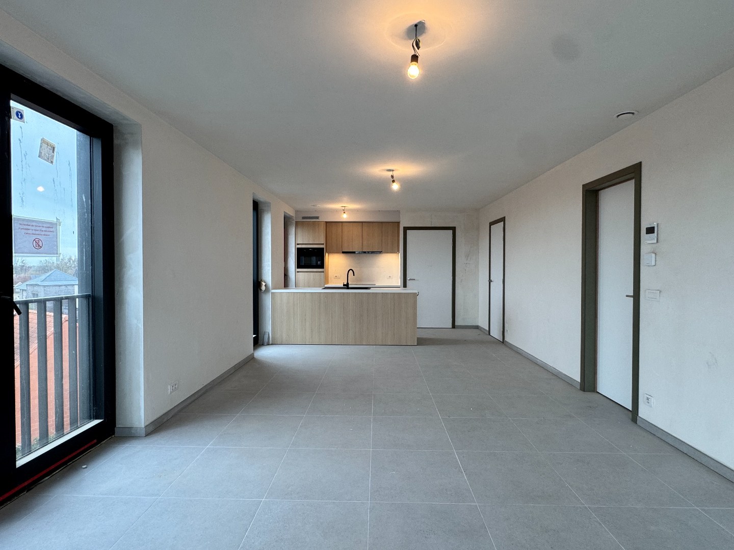 Nieuwbouwappartement met twee slaapkamers, terras en ondergrondse autostaanplaats te koop in Zulte 