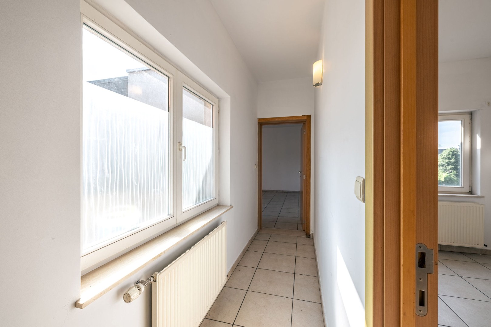 Lichtrijk en instapklaar wonen op de tweede verdieping nabij Gent 