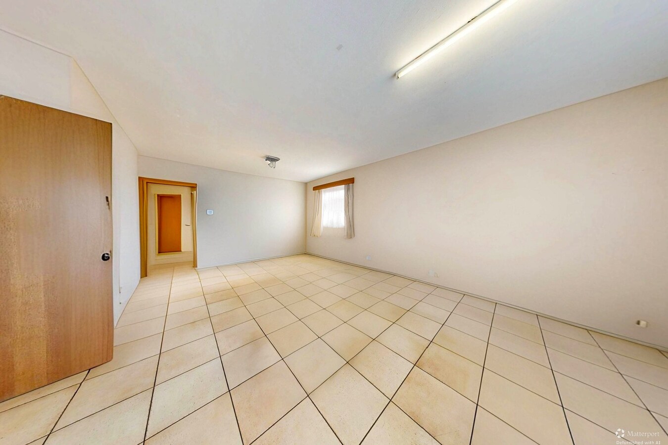 Woonkamer vooraan ontmeubeld