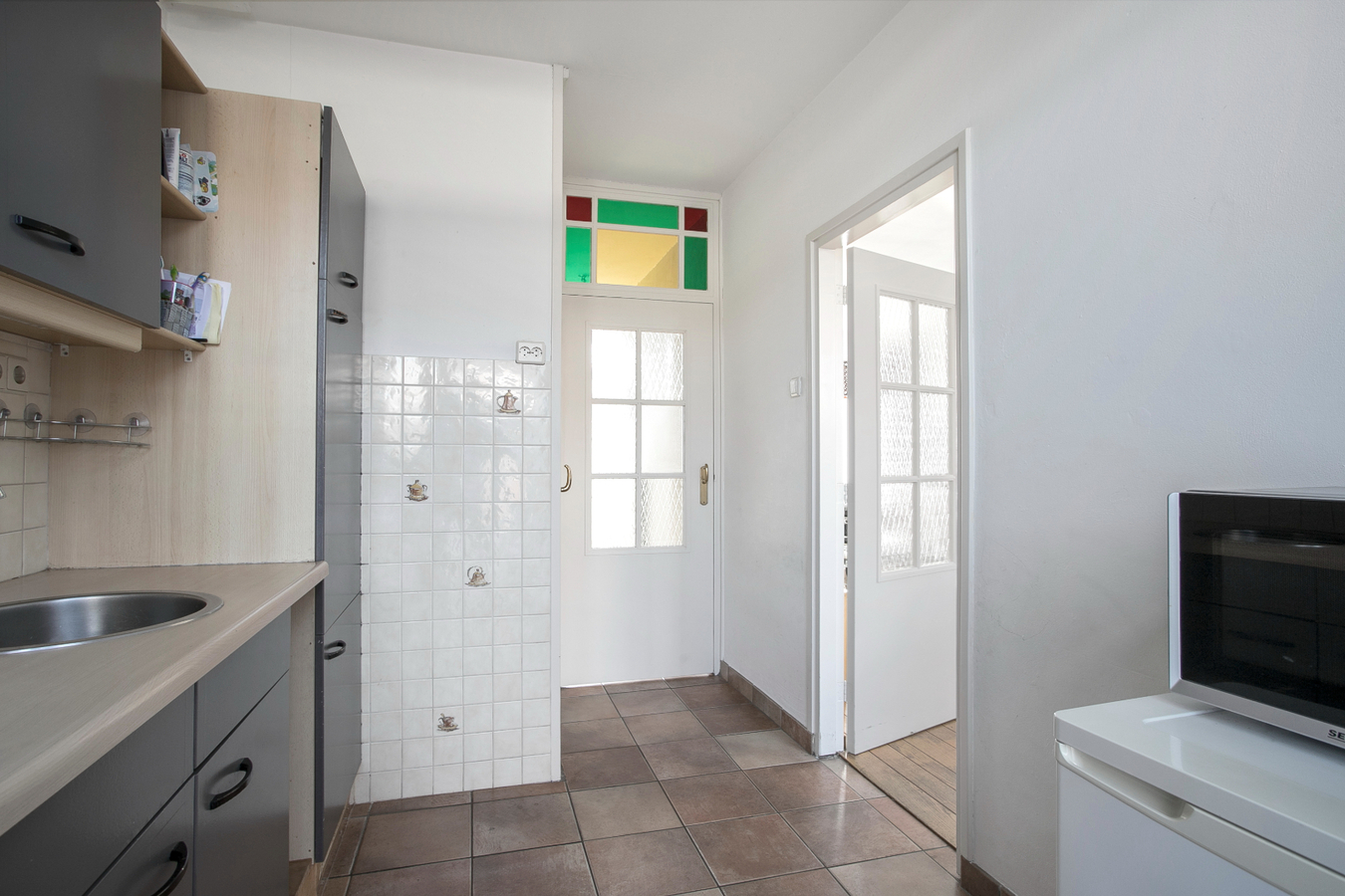 Eindwoning met berging, overkapping, ondergrond, erf, tuin- en verdere aanhorigheden. 