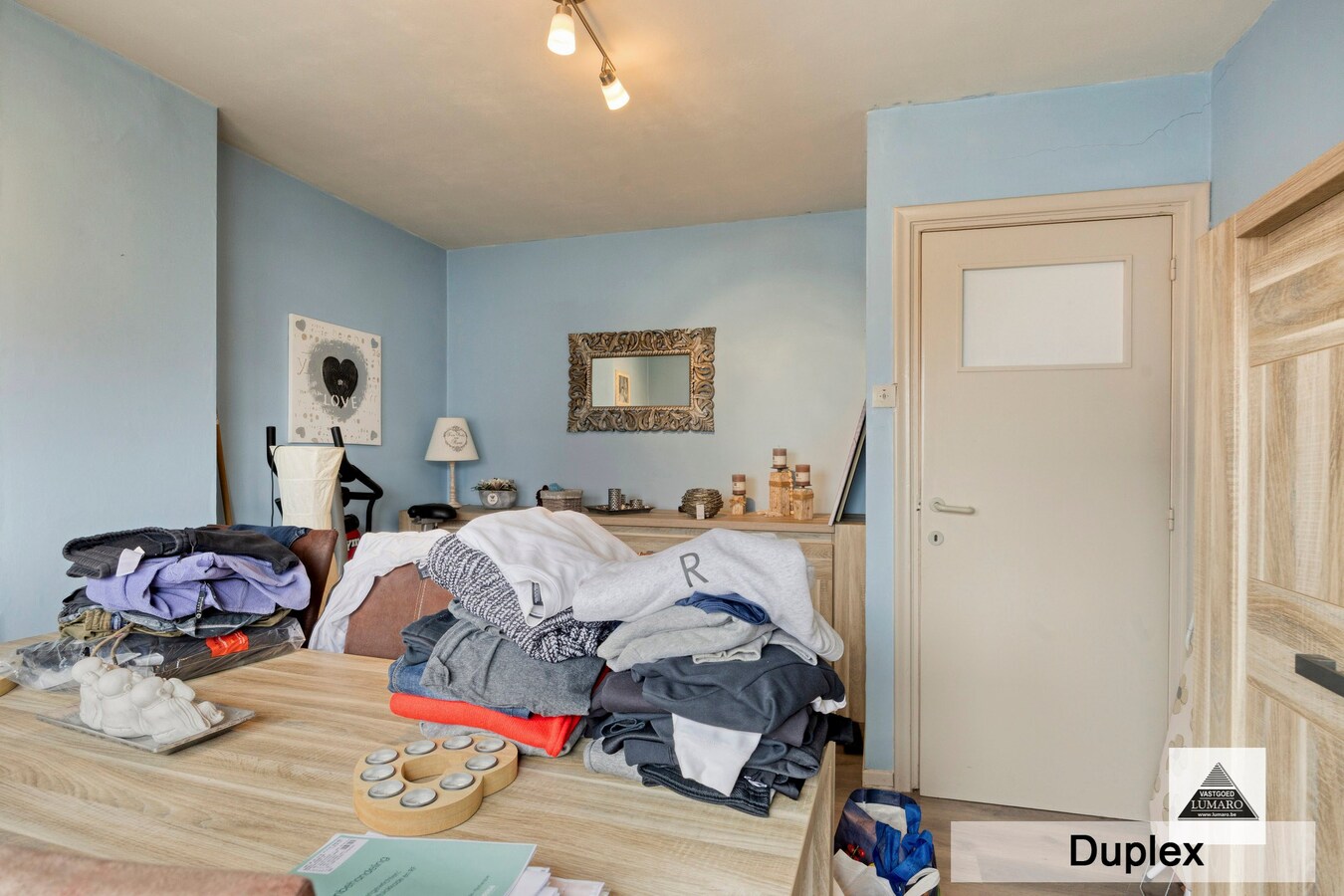 Dilsen-centrum - opbrengstpand: winkel + 2 appartementen 