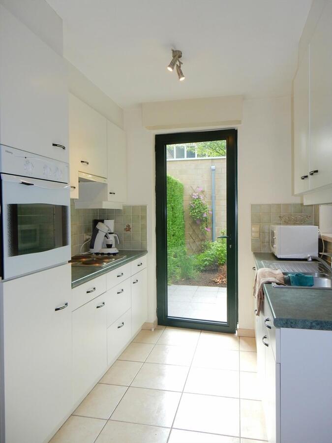 Gezellig gelijkvloersappartement met zonnige tuin en garage 