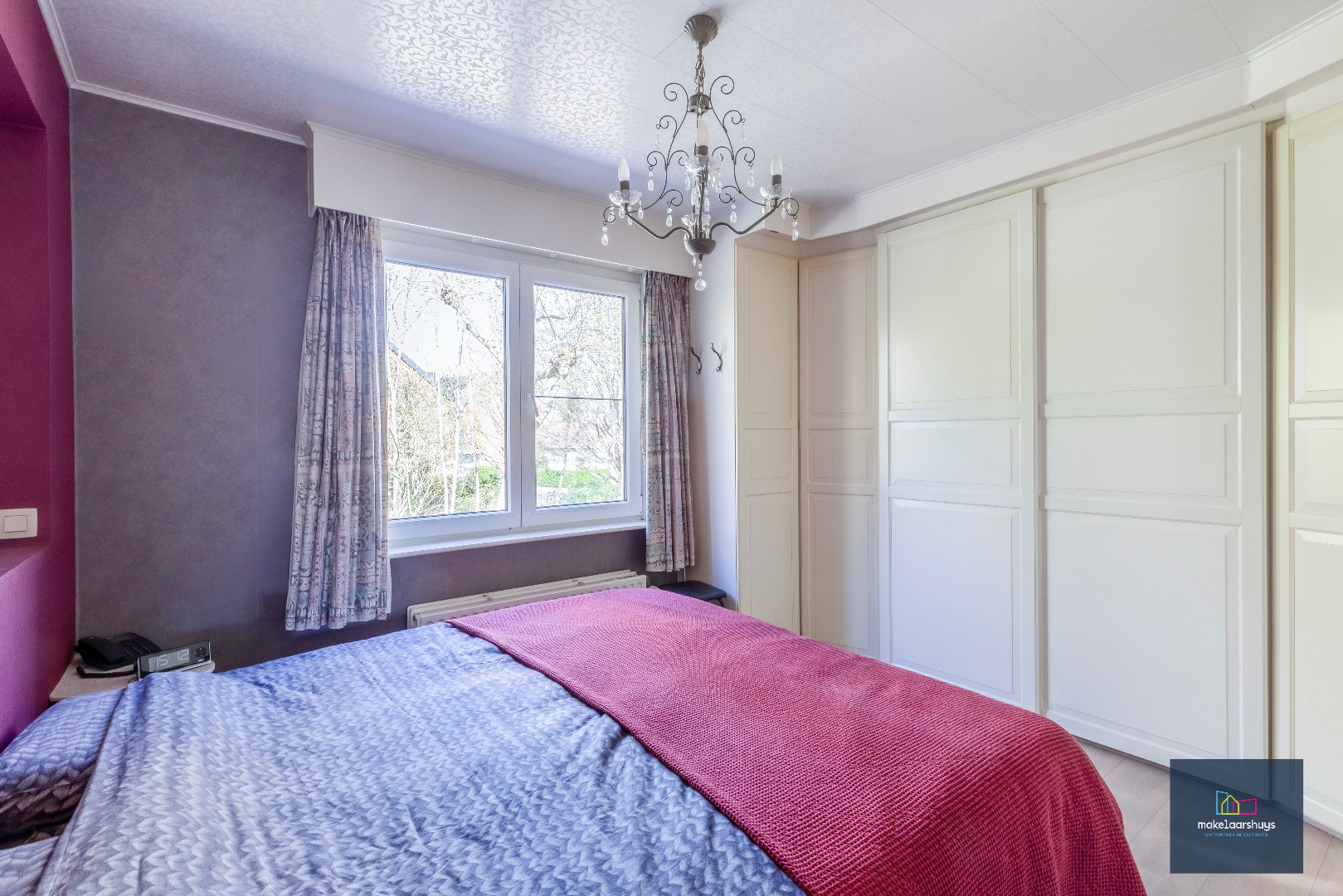 Goed onderhouden en ruime woning in rij met tuin/terras te Wondelgem 