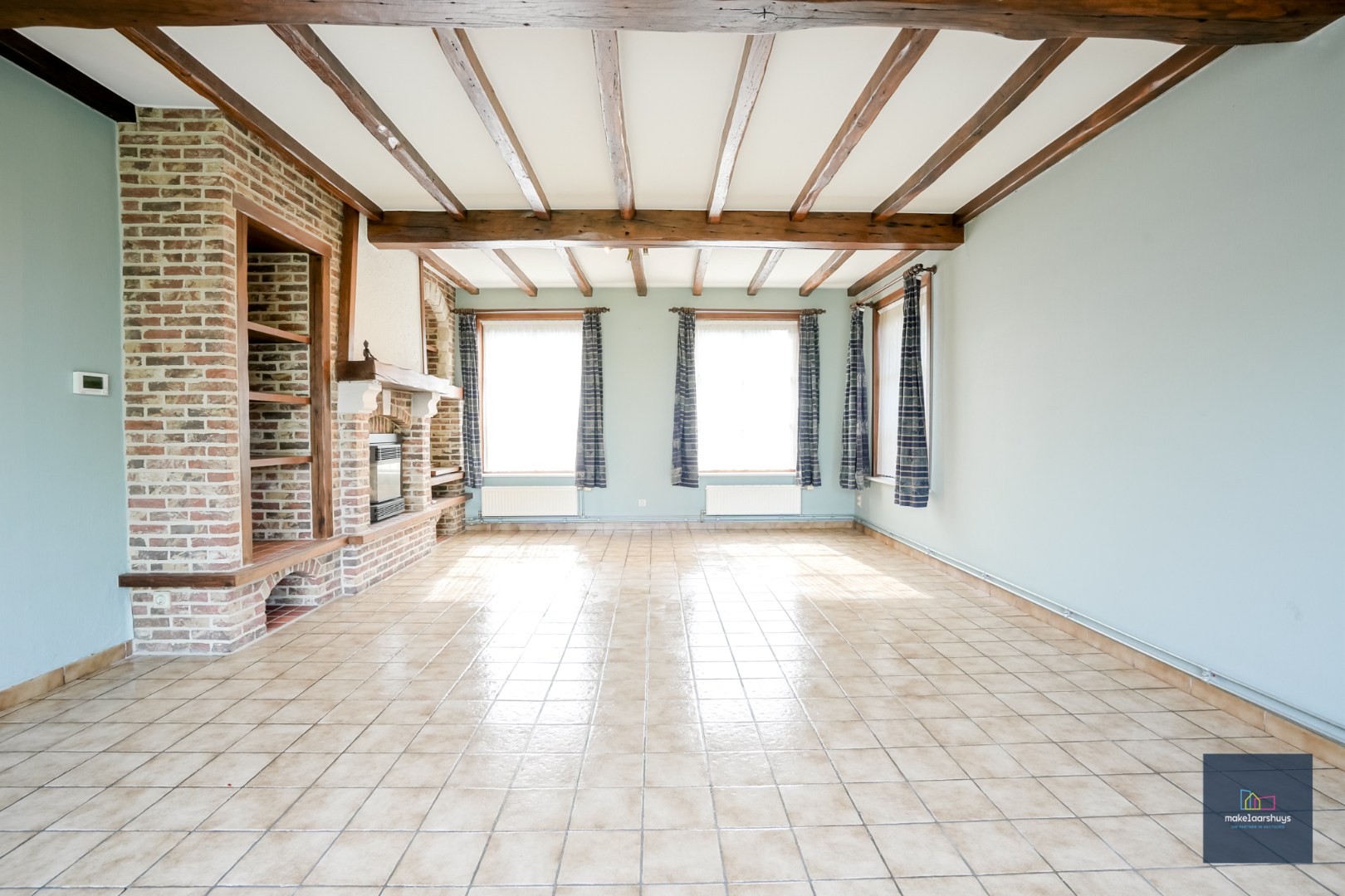 Ruime  halfopen bebouwing  met  zonnige tuin, terras en garage in Waarschoot 